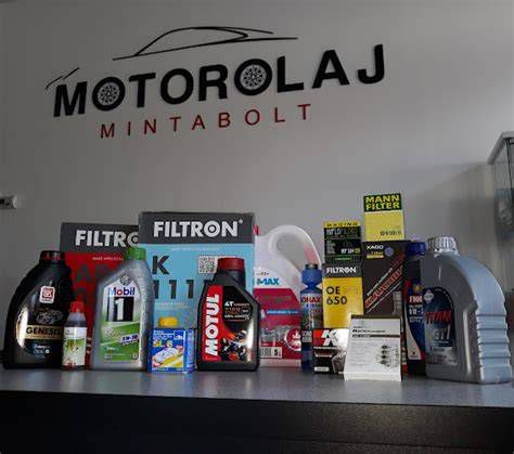Autószerelő motorolaj flakonnal
